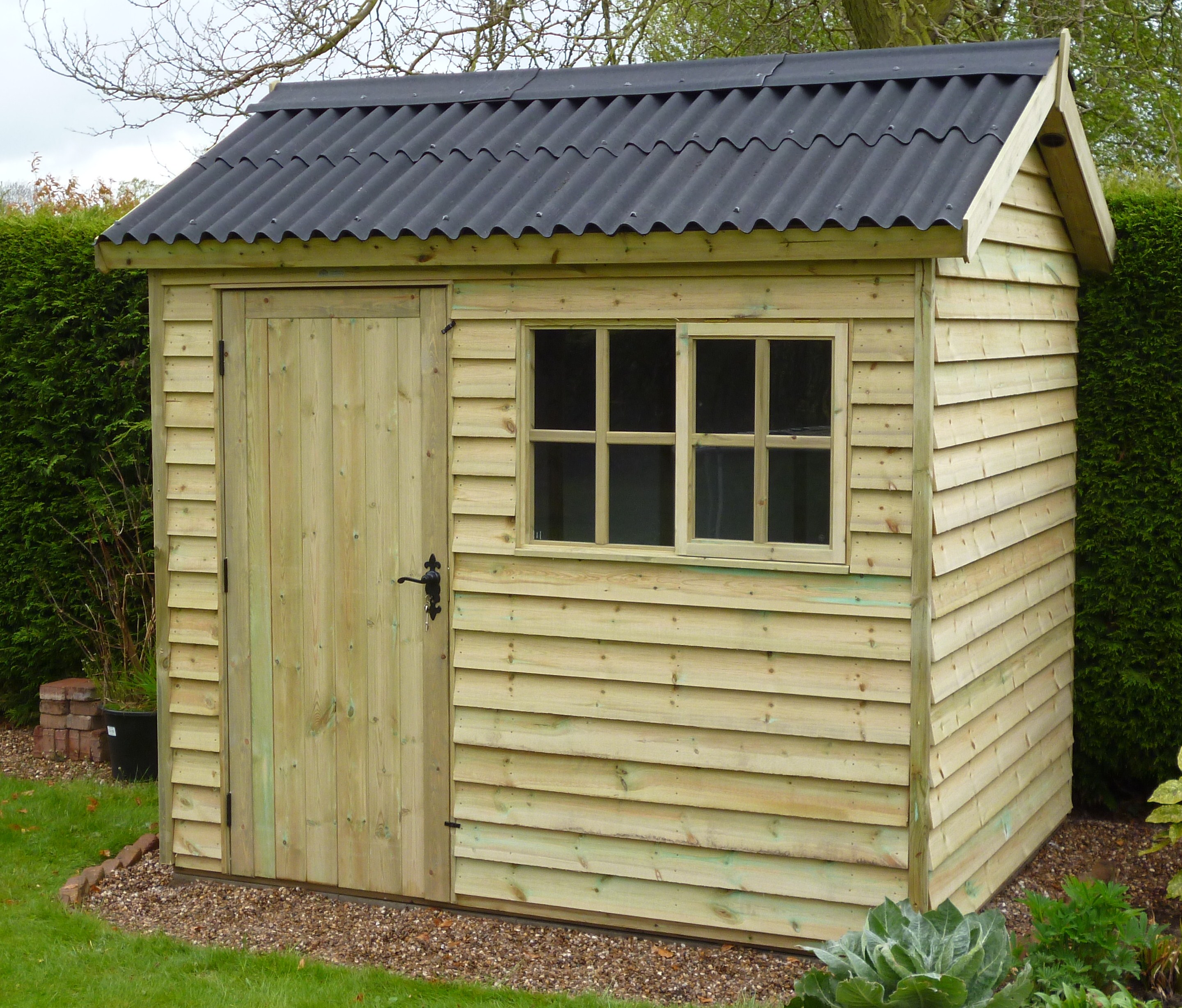 garden sheds add a whimsical touch to a back yard
